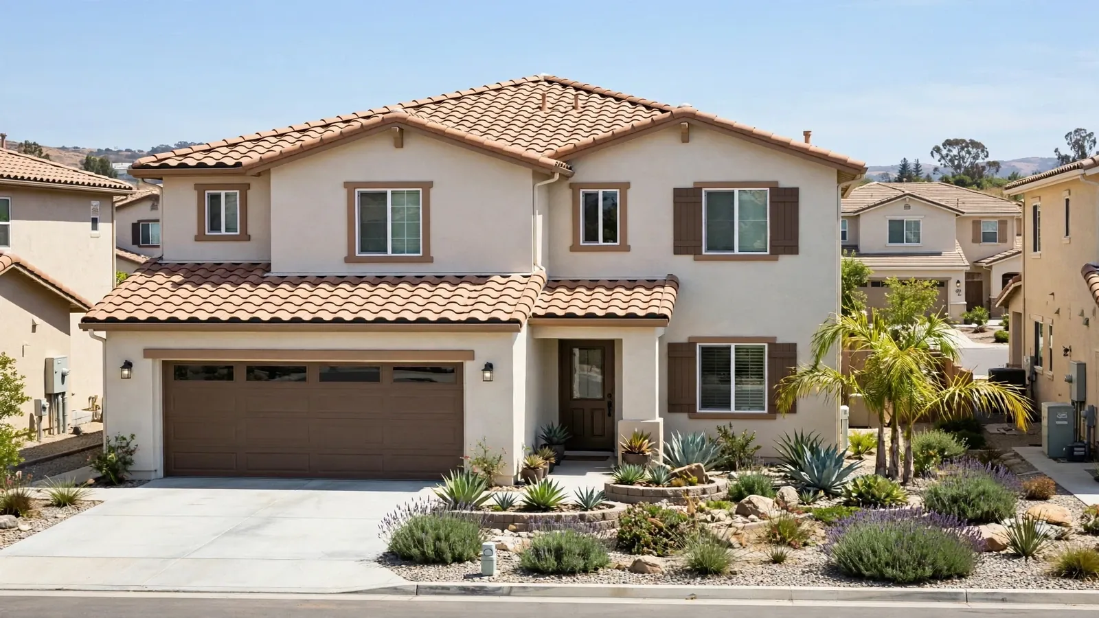 Home with a tile roof and landscaped yard in Lake Forest, California